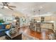 Open concept living room flows to the kitchen and dining area, hardwood floors, and ample lighting at 216 Grand View Dr, New London, NC 28127