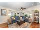 Spacious living room featuring hardwood floors, large windows, comfortable seating, and stylish decor at 216 Grand View Dr, New London, NC 28127