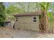 Backyard shed with double doors and windows, situated near the lake at 216 Grand View Dr, New London, NC 28127