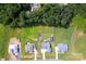 A bird's eye view of three homes in a community surrounded by lush, green trees at 307 Stoneyard Rd, Richfield, NC 28137