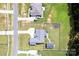 An aerial view looking down at three homes in a community with large yards at 307 Stoneyard Rd, Richfield, NC 28137