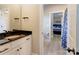 Modern bathroom featuring a black granite countertop and access to the bedroom at 307 Stoneyard Rd, Richfield, NC 28137