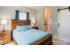 Bedroom with wood accents, ensuite bathroom and modern sliding barn door at 307 Stoneyard Rd, Richfield, NC 28137