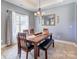Elegant dining room with natural light, wood table and seating, perfect for entertaining at 307 Stoneyard Rd, Richfield, NC 28137