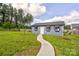 Charming exterior view of house with landscaped yard and a stone walkway at 307 Stoneyard Rd, Richfield, NC 28137
