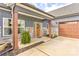 Inviting covered front porch with stone accents, neutral siding, and a wooden front door at 307 Stoneyard Rd, Richfield, NC 28137