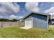 A detached one car garage sits at the back of the yard with a single, white door at 307 Stoneyard Rd, Richfield, NC 28137