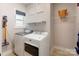 Bright laundry room with modern washer, dryer and wire shelving at 307 Stoneyard Rd, Richfield, NC 28137