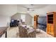 Cozy living room featuring vaulted ceilings, ceiling fan, and comfortable seating area at 307 Stoneyard Rd, Richfield, NC 28137