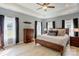 Spacious main bedroom with tray ceiling, dark wood furniture, ample natural light, and neutral décor at 307 Stoneyard Rd, Richfield, NC 28137