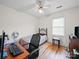 Cozy bedroom featuring a ceiling fan, wood floors, and a bright window for natural light at 3206 Basilwood Cir, Monroe, NC 28110