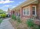 Charming front porch with brick pillars, offering a welcoming curb appeal at 3206 Basilwood Cir, Monroe, NC 28110