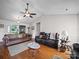 Bright living room with hardwood floors, offering comfortable seating and ample space at 3206 Basilwood Cir, Monroe, NC 28110