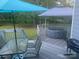 Relaxing deck area with a hot tub, patio furniture, and serene wooded surroundings at 3711 Davis Dr, Charlotte, NC 28270