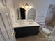 Stylish bathroom features a double sink vanity with elegant fixtures and a tiled tub at 3711 Davis Dr, Charlotte, NC 28270
