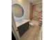 Bathroom with stylish herringbone tile accent wall, a vessel sink, and modern fixtures at 3711 Davis Dr, Charlotte, NC 28270