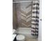 Bathroom showcases a tiled shower and tub combination with neutral accents and modern fixtures at 3711 Davis Dr, Charlotte, NC 28270