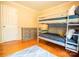 Cozy bedroom with hardwood floors, bunk beds, and natural light at 3711 Davis Dr, Charlotte, NC 28270