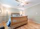 Bedroom with wood floors, ceiling fan and decorative elements creating a comfortable space at 3711 Davis Dr, Charlotte, NC 28270