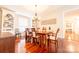 Elegant dining room with hardwood floors, a chandelier, and built-in shelving at 3711 Davis Dr, Charlotte, NC 28270
