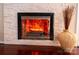 Close up of fireplace, which is set in a stone surround and complimented with hardwood floors at 3711 Davis Dr, Charlotte, NC 28270