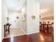 Inviting foyer with warm wood floors, stylish console table, and a view into the dining room at 3711 Davis Dr, Charlotte, NC 28270