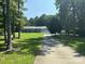 Charming single-story home with a well-manicured lawn, mature trees, and an attached garage at 3711 Davis Dr, Charlotte, NC 28270