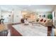 Open concept living room with hardwood floors, neutral decor, and lots of natural light at 3711 Davis Dr, Charlotte, NC 28270