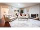 Inviting living room features a cozy fireplace, plush sofas, and a stylish coffee table at 3711 Davis Dr, Charlotte, NC 28270