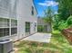 Wide backyard with patio, white house siding, shed, and a wood-layered raised garden at 3830 Brookchase Ln, Charlotte, NC 28205