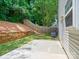 Backyard featuring a concrete patio, a fenced yard, and a sloped garden bed at 3830 Brookchase Ln, Charlotte, NC 28205