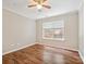 Bedroom featuring hardwood floors, ceiling fan, and ample natural light at 3830 Brookchase Ln, Charlotte, NC 28205