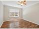 Bedroom featuring hardwood floors, ceiling fan, and ample natural light at 3830 Brookchase Ln, Charlotte, NC 28205