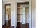 A closet features built-in shelving, wooden rods, and ample space for organization and storage at 3830 Brookchase Ln, Charlotte, NC 28205