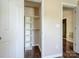 This closet design features custom shelving with wooden closet rods for optimal storage and organization at 3830 Brookchase Ln, Charlotte, NC 28205