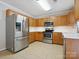 Kitchen with stainless steel appliances, tile backsplash and countertop at 3830 Brookchase Ln, Charlotte, NC 28205