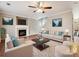 This staged living room features neutral furniture, a fireplace, and stylish decor, perfect for relaxation at 3830 Brookchase Ln, Charlotte, NC 28205