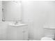 Neat bathroom with white fixtures, a vanity with storage, and tiled walls at 408 Kennerly Dr, Indian Trail, NC 28079