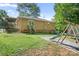 Back exterior featuring a swing set, deck, and sliding door leading to the yard at 408 Kennerly Dr, Indian Trail, NC 28079