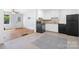 Bright kitchen featuring tiled floors, white cabinets and modern black appliances at 408 Kennerly Dr, Indian Trail, NC 28079