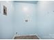 Small laundry room with blue walls, utility connections, and space-saving design at 408 Kennerly Dr, Indian Trail, NC 28079