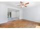 Open floor plan with hardwood floors, leading to an additional living space at 408 Kennerly Dr, Indian Trail, NC 28079