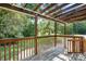 Covered porch area with wooden beams, offering a shaded outdoor living space at 408 Kennerly Dr, Indian Trail, NC 28079