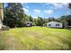 Large backyard featuring green lawn, a carport, and a single story home at 508 Bridgestone Ln, Rock Hill, SC 29730
