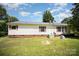 Back of home with siding, brick foundation, a small deck, and air conditioner at 508 Bridgestone Ln, Rock Hill, SC 29730