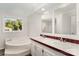 Bright bathroom features a large soaking tub beneath a window and double sink vanity at 508 Bridgestone Ln, Rock Hill, SC 29730