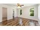 Inviting bedroom featuring two large windows and elegant laminate flooring, offering a serene and comfortable retreat at 508 Bridgestone Ln, Rock Hill, SC 29730