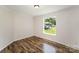 Bright bedroom with warm wood floors and a large window at 508 Bridgestone Ln, Rock Hill, SC 29730
