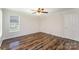 Comfortable bedroom featuring ample natural light and stylish laminate flooring, providing a cozy and modern space at 508 Bridgestone Ln, Rock Hill, SC 29730