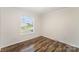 Well-lit bedroom offers wood floors and a window for natural light at 508 Bridgestone Ln, Rock Hill, SC 29730